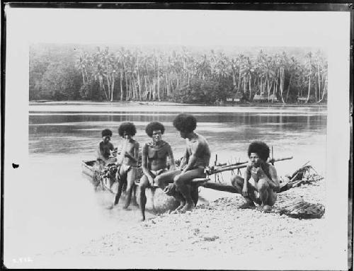 Five men in boat on water