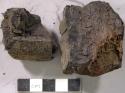 Daubs, clay and pipe fragments?, sherd with preforation, charred wood fragment