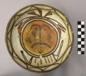 Bowl, polacca polychrome style c. int: clown design; ext: slipped, no design. 8.