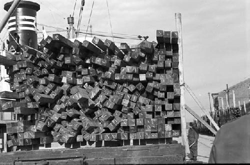 Full stack of wood hauled onto train