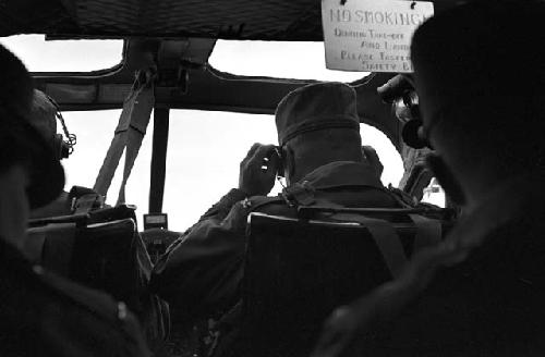 Portrait of pilots and passengers inside plane