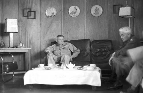 Portrait of soldiers sitting inside waiting room