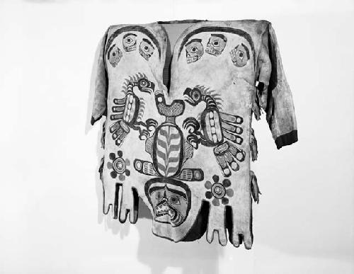 Man's shirt with human face and bird designs