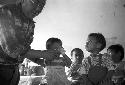 Portrait of man feeding baby milk