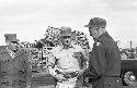 Soldier giving info to other soldiers standing by