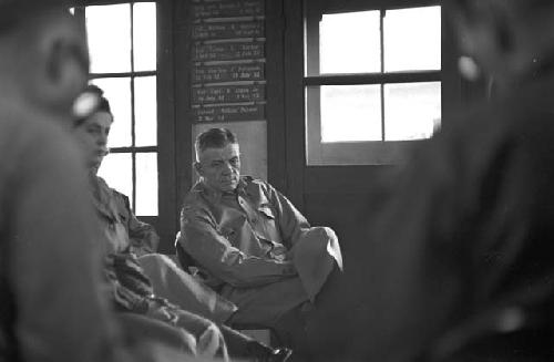 Portrait of man sitting in chair during meeting