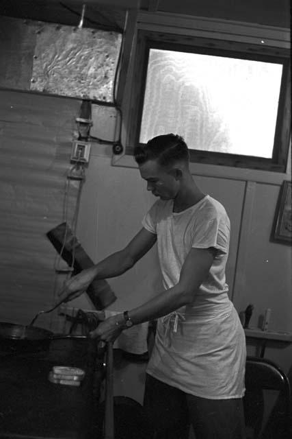 Portrait of man in kitchen preparing food