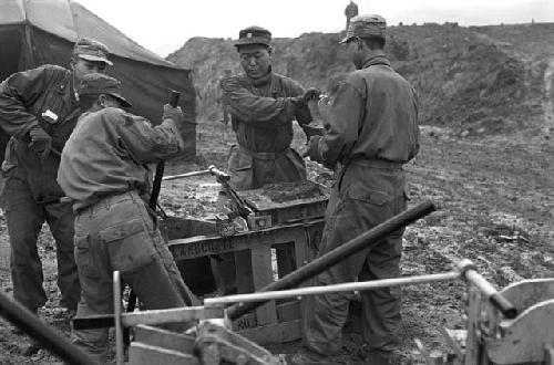 Workers using landcrete machine