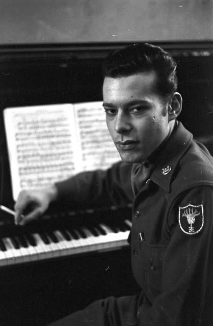 Officer smoking cigarette next to piano