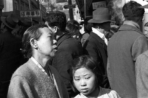 Woman and girl in crowd