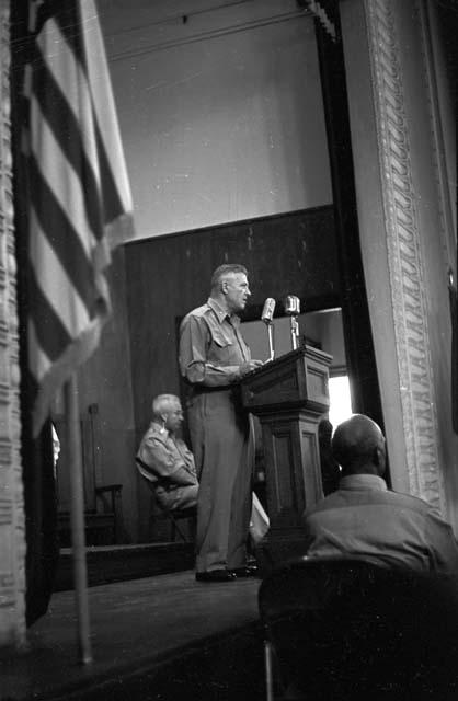 Portrait of soldier at podium addressing audience 2