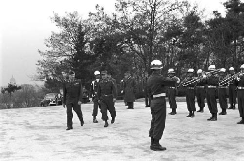 Soldiers playing horns during ceremony