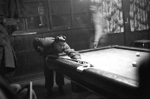 Soldiers in recreational room playing pool 2