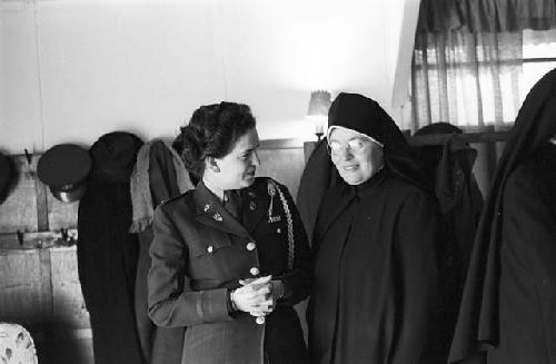 Portrait of nun and soldier standing side by side