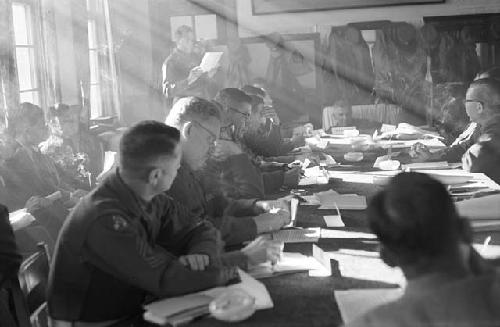 Portrait of soldiers and suits during meeting