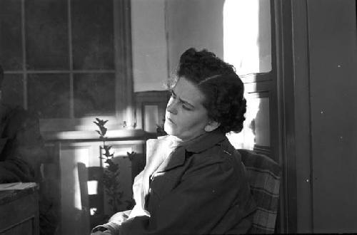 Woman sitting in chair during meeting