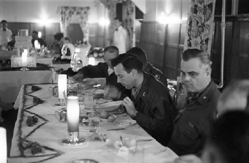 Portrait of soldiers eating dinner