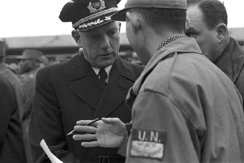 Soldiers meeting which each other reviewing paperwork 2