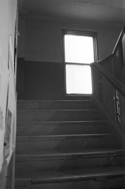 Portrait of window in middle of stairway