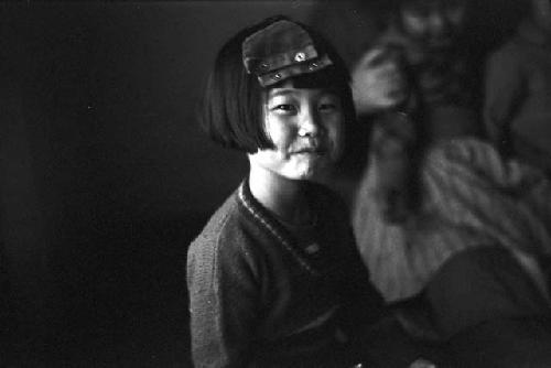 Portrait of girl with piece of clothing on head