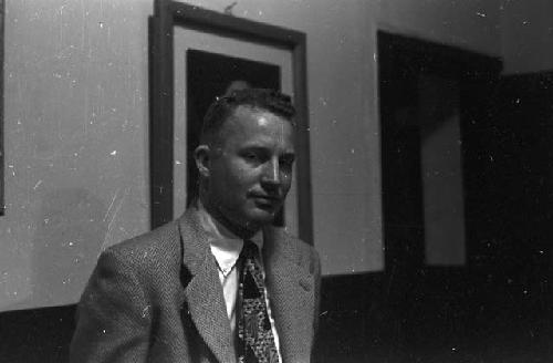 Portrait of man wearing suit sitting in office 2