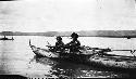 Men in canoe on river