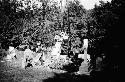 Crew installing gravestone in cemetery