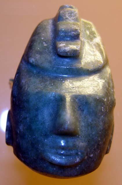 Carved jadeite ornament, human face, helmet