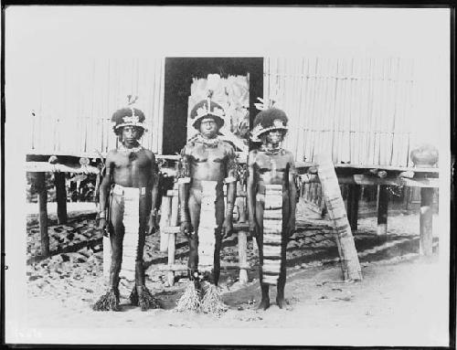 Three men with decorative clothing