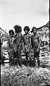 Group of village men by boat