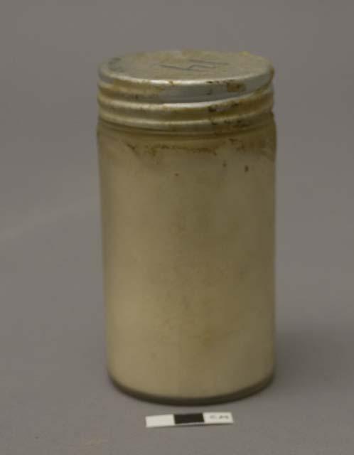 Bottle containing vu-vu or fu-fu, cassava meal