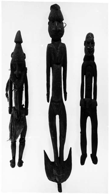 Three carved wooden ancestor figures