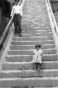 Girl and man walking down steps