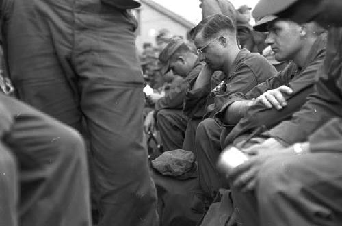 Portarit of soldiers sitting down in line