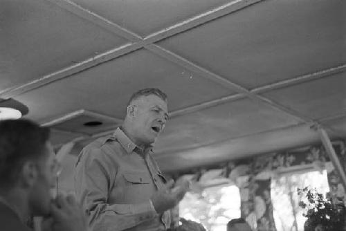 Man standing addressing audience