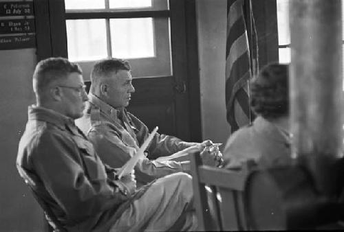 Portrait of soldiers sitting down during meeting