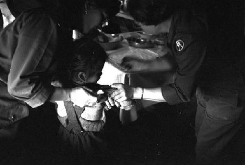 Nurse prepping baby for shot