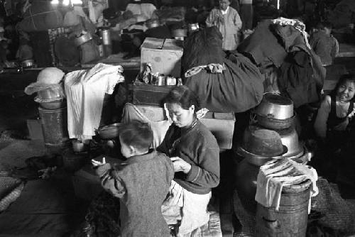 Woman and child inside shelter after fire