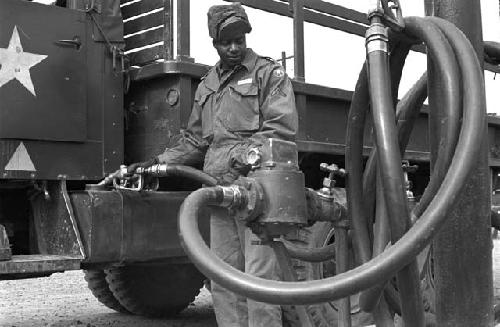 Soldier pumping gas into truck 2