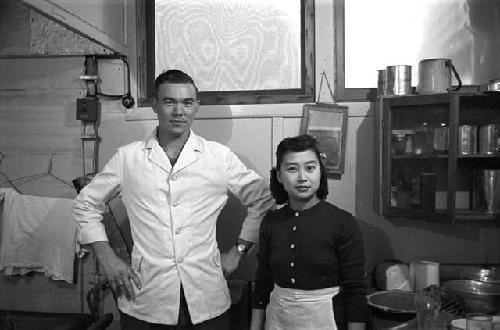 Portrait of man and woman chef in kitchen