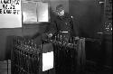 Portrait of soldier standing in front of rows of taps 2