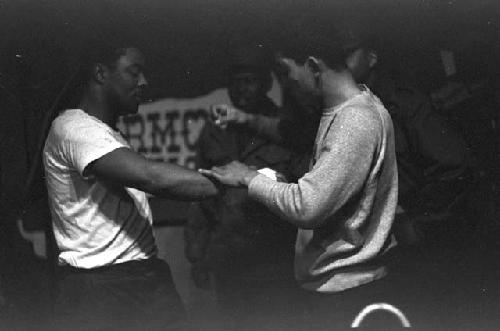 Trainer taping boxer's hand