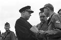 Portrait of officers shaking hands