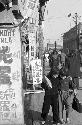 Portrait of pedestrians walking up and down the street