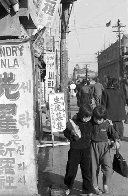 Portrait of pedestrians walking up and down the street