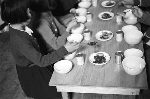 Children eating together at dinner table