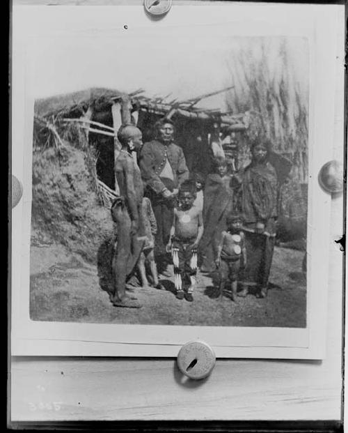 People in front of hut