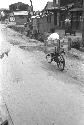 Shot of man riding bike on dirt road