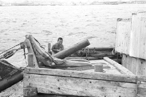 Nude boy on old deck