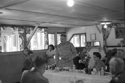 Soldier speaking at head table in front of audience